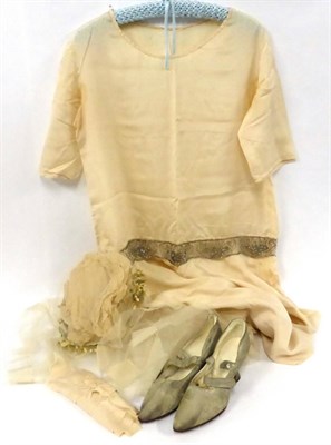 Lot 2113 - Circa 1920s Drop Waist Cream Silk Wedding Dress, with short sleeves, scoop neck and silver bead...