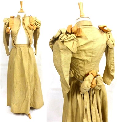 Lot 2137 - Late 19th Century Dark Cream Silk Two Piece Costume, comprising a fitted long sleeved jacket of...