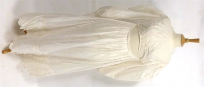 Lot 2138 - Circa 1805-10 White Cotton Apron Front Dress, with long sleeves, round neck, five cut work and...