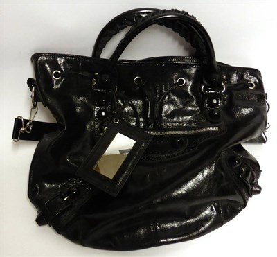 Lot 2158 - Balenciaga Black Patent Leather Pom Pom Shoulder Bag, with silver coloured hardware, drawstring...