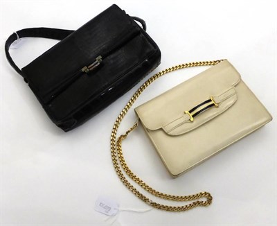 Lot 2162 - Circa 1960s Gucci Cream Leather Shoulder Bag, with navy and cream enamel buckle, chain link...