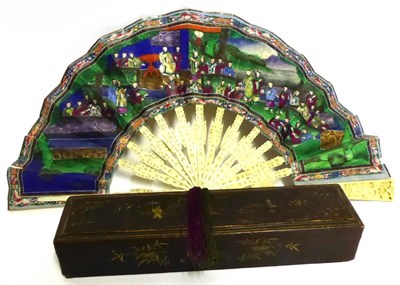 Lot 2176 - A Late 18th Century Chinese Carved Ivory Fan, with painted paper mount hand decorated with figures