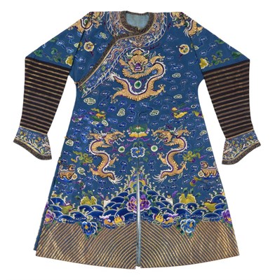 Lot 2177 - An Early 20th Century Blue Silk Dragon Robe, stitched in gilt metal threads with four claws,...