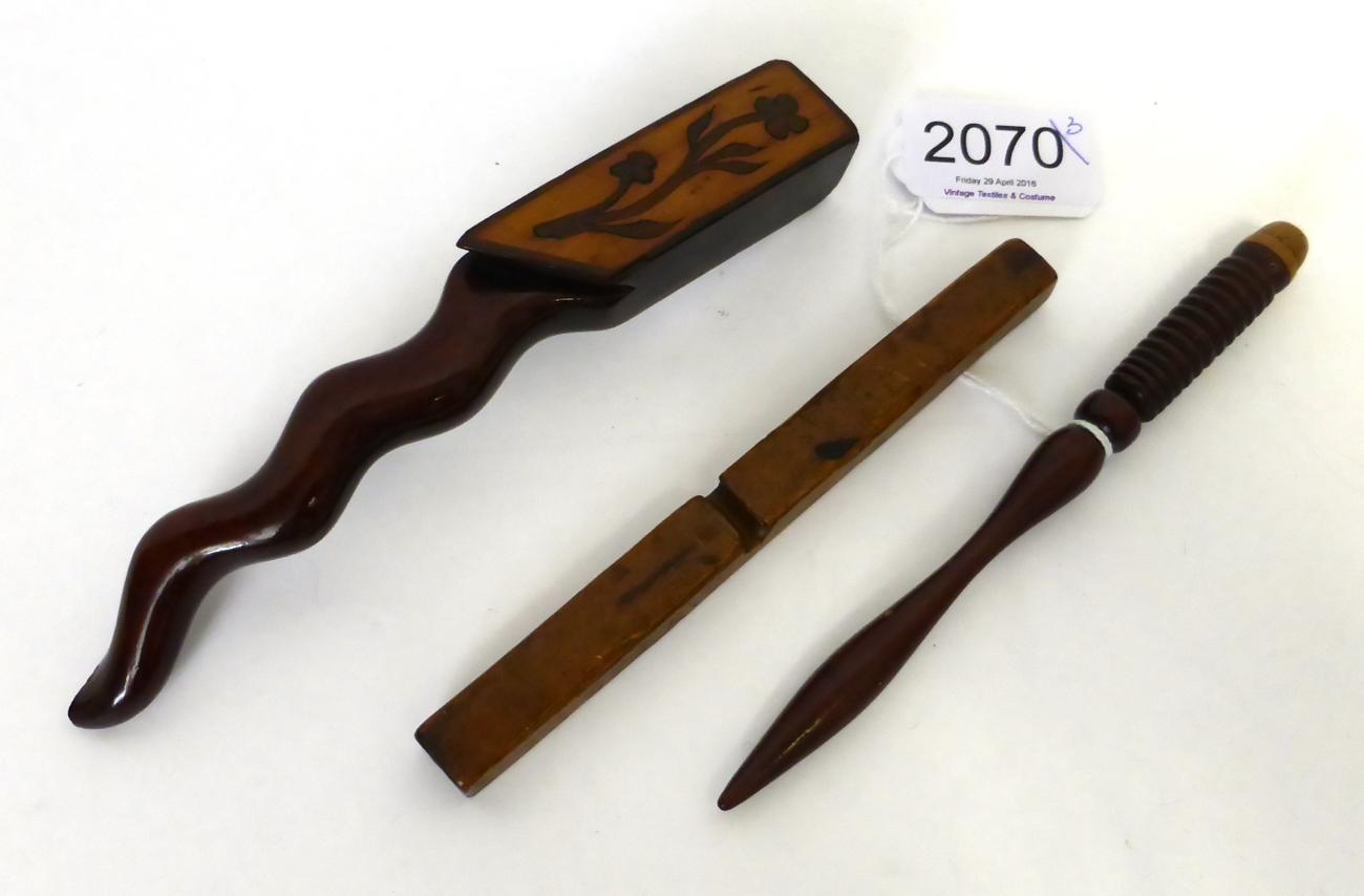 Lot 2070 - 19th Century Peg Treen Knitting Stick, of sinuous form inlaid with a flower, 16.5cm by 2cm;...