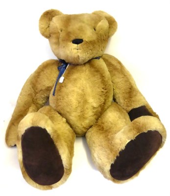 Lot 2011 - A Very Large Jointed Hartley Bear's Emporium Teddy Bear in light tan plush, dark tan suede paw...