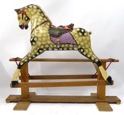 Lot 2012 - A Dapple Grey Painted Rocking Horse, on treadle stand, with saddle and bridle, real mane and...