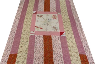 Lot 2029 - Large 19th Century Patchwork Cover, comprising decorated printed cottons in stripes, with a...