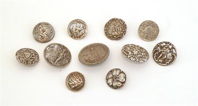 Lot 2055 - Eleven Pierced and Embossed Early 20th Century Silver Buttons, of various designs