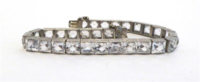 Lot 2082 - A Synthetic White Sapphire Bracelet, set with fancy square stones, length 18.5cm NB the...