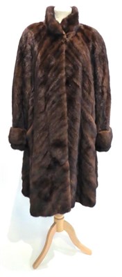 Lot 2104 - A Brown Mink Royal Saga Coat, with diagonal pelts, fold back cuffs