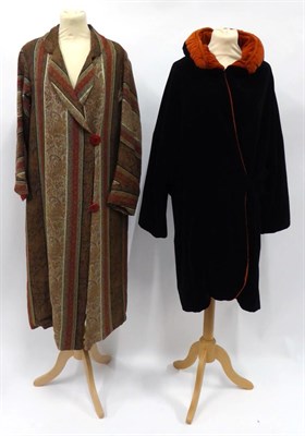 Lot 2195 - Circa 1920s Paisley Red Ground Woven Full Length Coat, with long sleeves and two large red...