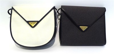 Lot 2231 - Yves Saint Laurent Shoulder Bag, with cream textured front, back  and navy leather trims and...