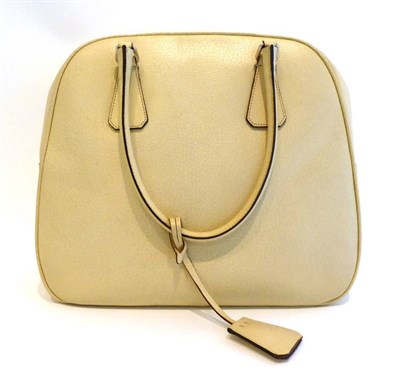 Lot 2242 - Prada Cream Leather Shoulder Bag, with two leather hinged handles, two leather mounts to base,...