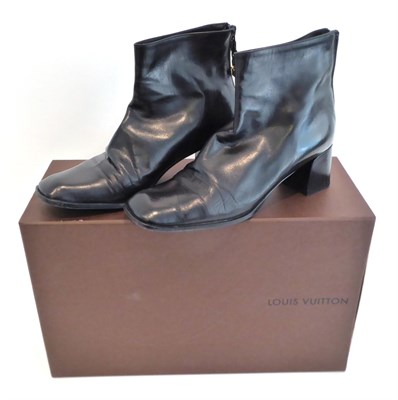 Lot 2268 - Pair of Black Leather Louis Vuitton Ankle Boots, zip to the back hung with pair of LV gilt...