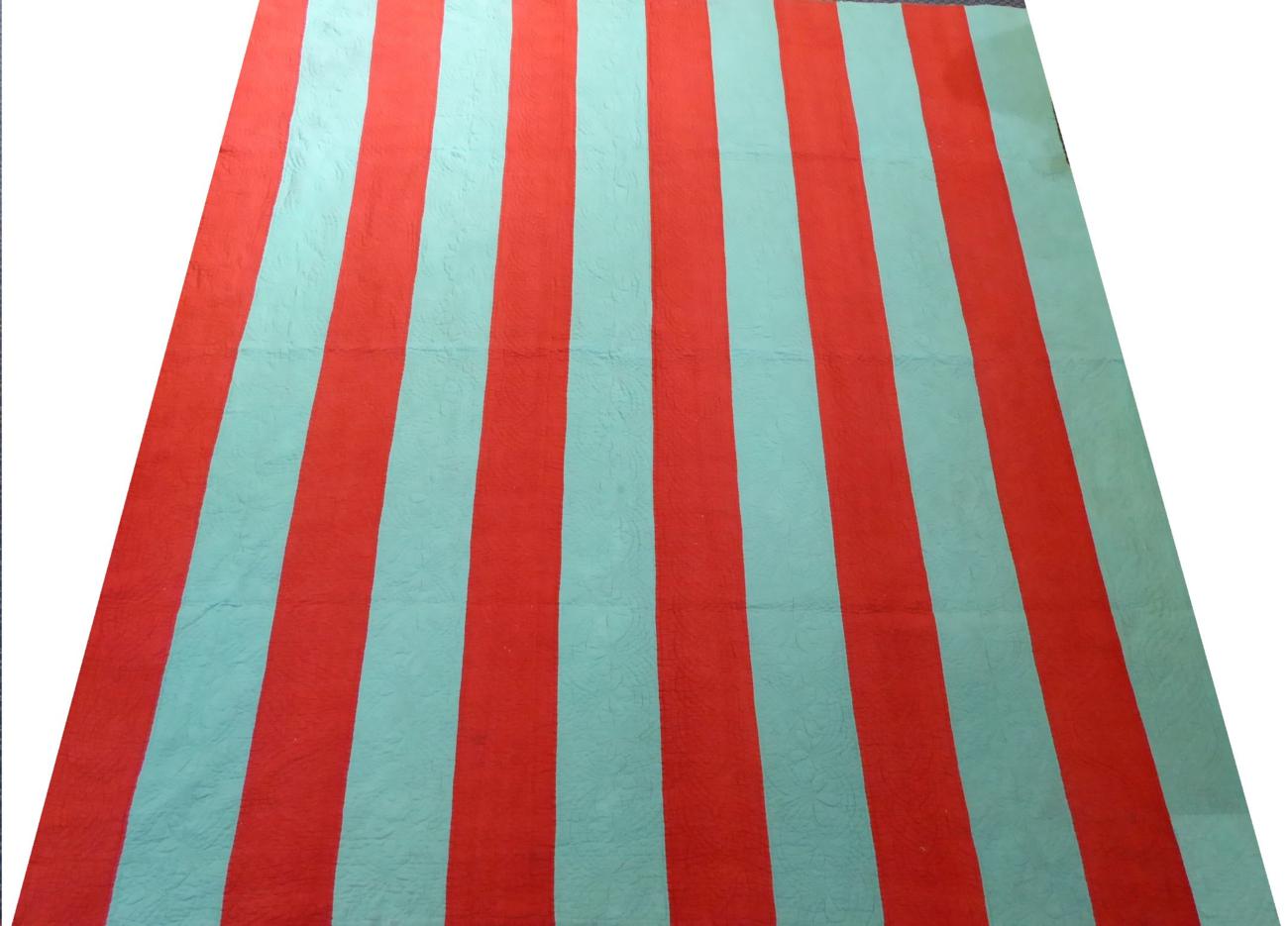 Lot 2011 - Late 19th Century Red and Green Striped Quilt, with cream reverse, 240cm by 210cm