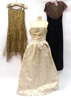 Lot 2052 - Circa 1920s Gold Net Sleeveless Flapper Dress, with lace mount; Circa 1930s Black Crepe Evening...