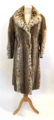 Lot 2102 - A Lynx Coat, of panelled design, with drawstring waist, and original restorers receipt