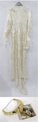 Lot 2104 - A Late 1940s Emenson Wedding Dress, of floral design with long sleeves, waist ties, long skirt...