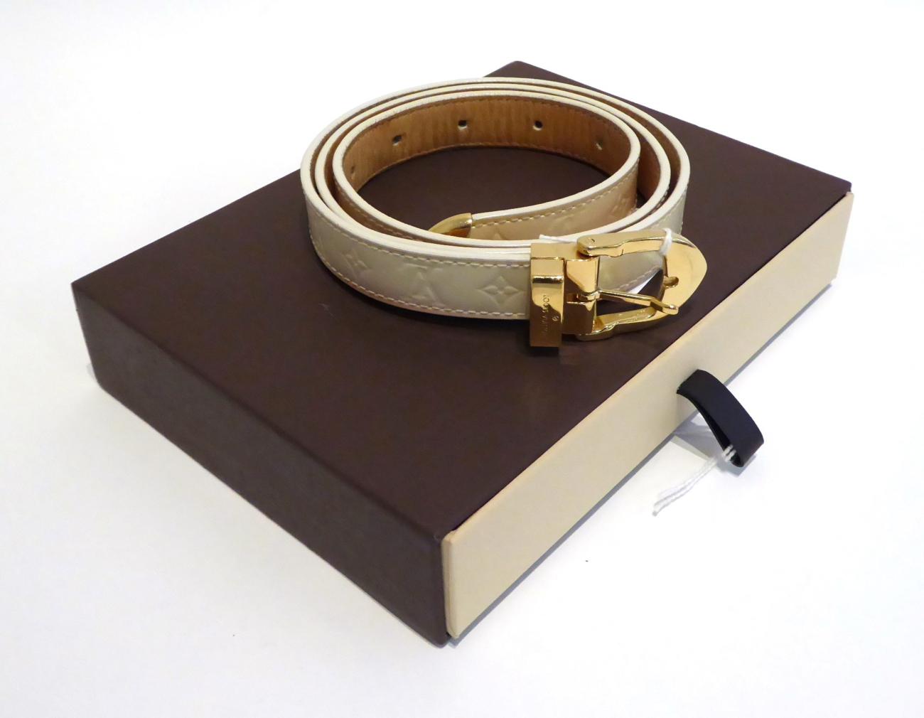 Lot 2138 - Louis Vuitton Patent Cream Skinny Belt, with embossed LV pattern, 90cm long, with original box