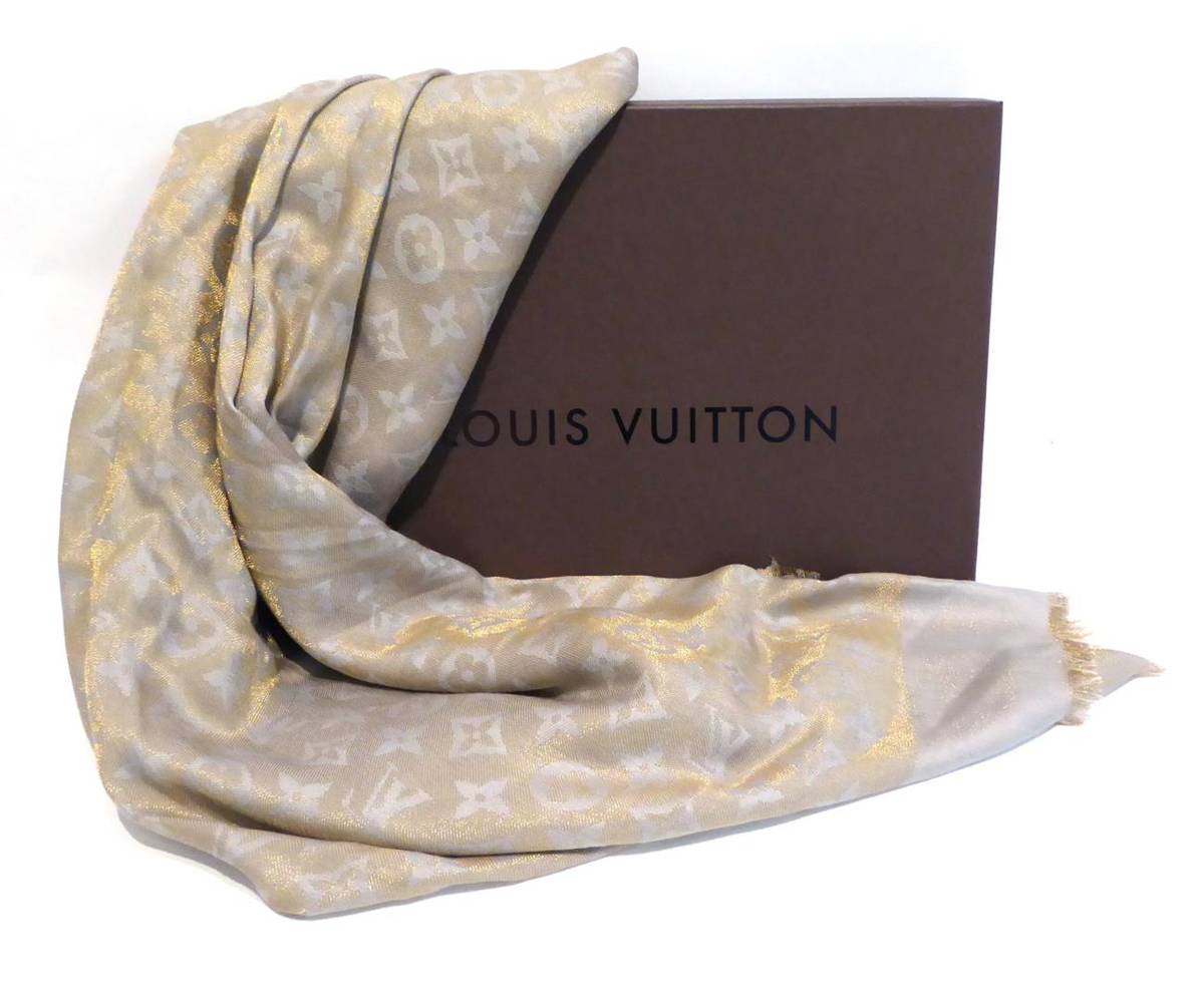 Lot 2139 - Louis Vuitton Grey/Light Blue and Metallic Thread Scarf, with fringed edges and LV pattern,...
