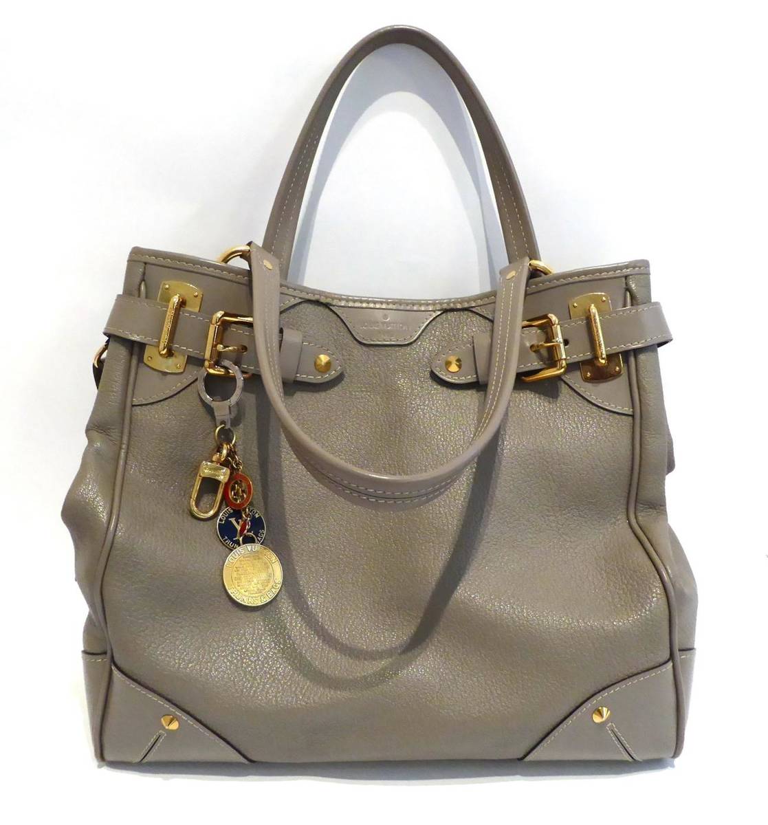 Lot 2144 - Louis Vuitton Grey Leather Handbag, with gilt metal fittings, attached LV bag charm and luggage tag