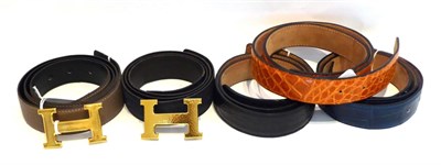 Lot 2162 - A Hermes Leather Taupe/Mushroom Belt, and another Navy Blue Example; two Hermes H Gilt Metal...