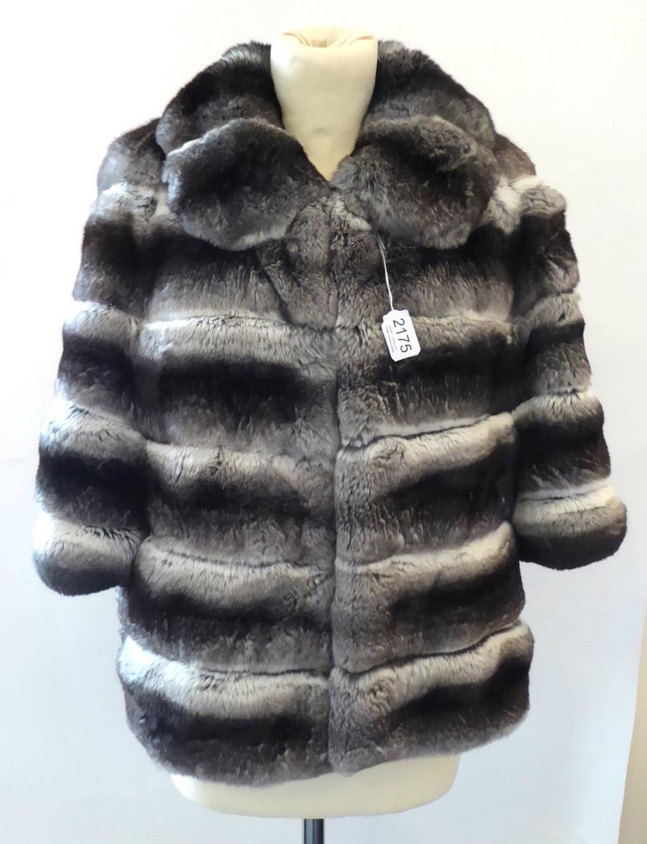 Lot 2175 - Grey Chinchilla Fur Cropped Jacket, the blue lining printed with jewelled crucifix