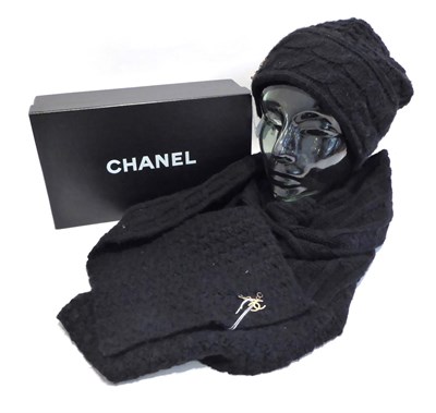 Lot 2198 - Chanel Black Knitted Scarf and matching Chanel Beanie Hat, 30% wool, 70% acrylic, with...