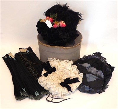 Lot 2201 - A Victorian Black Straw Bonnet, with black velvet ribbon, feather, faux flower and sequin appliques