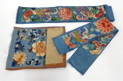 Lot 2223 - Two Chinese Blue Silk Sleeve Bands, embroidered similarly with bats and chrysanthemums and a floral