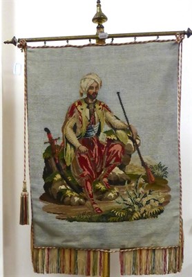 Lot 2229 - A Victorian Needlepoint Panel, in petit point and gros point, depicting a seated Ottoman boy in...