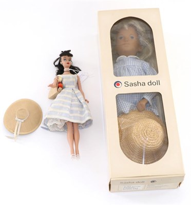 Lot 2004 - A Blond Sasha Doll, in blue gingham dress, with original box; and a circa 1960s Barbie Doll by...