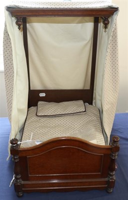 Lot 2005 - A Victorian Mahogany Dolls Half Tester Bed, with turned bed ends, replacement curtain, bed...