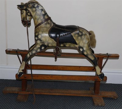 Lot 2010 - Early 20th Century Small Grey Dapple Rocking Horse, fitted with saddle and bridle, on a fixed...