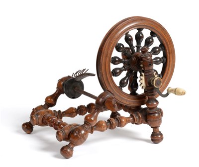 Lot 2044 - Early 19th Century Walnut Bobbin Turned Winder, with a spoke filled wheel, turned by an ivory...
