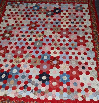 Lot 2078 - A Large 19th Century Patchwork Cover, comprising hexagonal flowers, separated by single red...