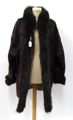 Lot 2127 - A Brown Astracan Jacket, with fox fur trims, tan leather lining and brown suede pockets