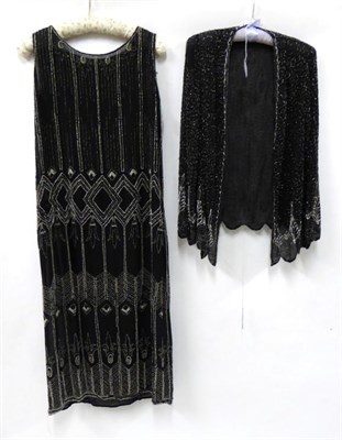 Lot 2135 - Radiah Paris 1920s Shift Dress, sleeveless with drop waist and bead decoration on black...