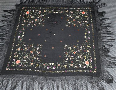 Lot 2143 - An Early 20th Century Chinese Black Silk Shawl, embroidered in coloured silks with decorative...