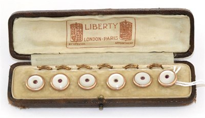 Lot 2212 - A Cased Set of Six Mother-of-Pearl and Paste Dress Buttons, cased by Liberty, mother-of-pearl discs