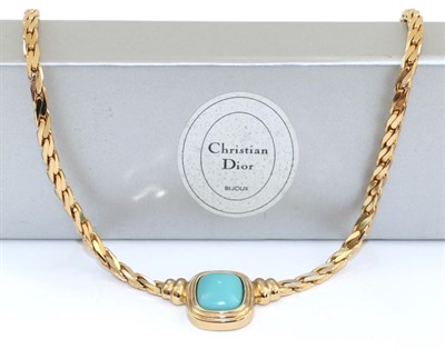 Lot 2213 - A Christian Dior Necklace, a simulated cabochon turquoise in a rubbed over setting to a flat...