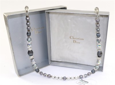 Lot 2214 - A Christian Dior Necklace, frosted glass beads alternate with metal spacers to a front strung...