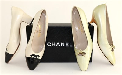 Lot 2248 - Pair of Chanel Court Shoes, in cream with black toes and logo, size 36.5, in a Chanel card box;...