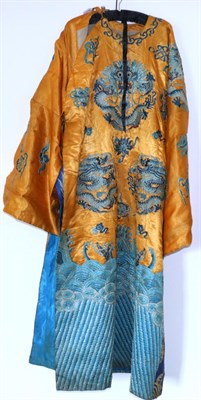 Lot 2266 - A 20th Century Chinese Orange Robe, with blue embroidered waves to the hem and embroidered with...