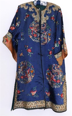 Lot 2271 - An Early 20th Century Chinese Blue Silk Robe, embroidered in coloured silks with decorative...