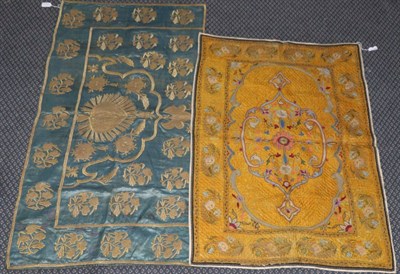 Lot 2272 - A 19th Century Wall Hanging of Eastern design, worked on a quilted yellow ochre silk ground,...