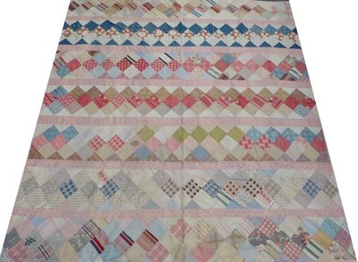 Lot 2012 - Victorian Patchwork Quilt, with a few later added pieces, designed with vertical stripes at...