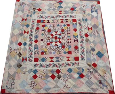 Lot 2013 - Mid-19th Century Block Patchwork Quilt, featuring a central square with pieced triangles,...