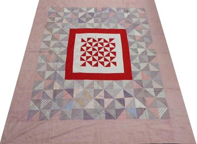 Lot 2017 - Mid-19th Century Large Patchwork Quilt, large central block of white cotton spotted in red bordered