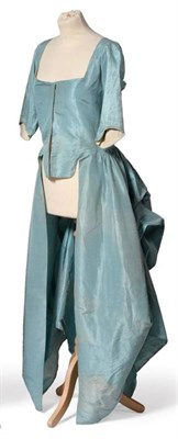 Lot 2038 - 18th Century Turquoise Ë† la Polonaise Plain Silk Gown, Circa 1770-1780, lacks petticoat,...